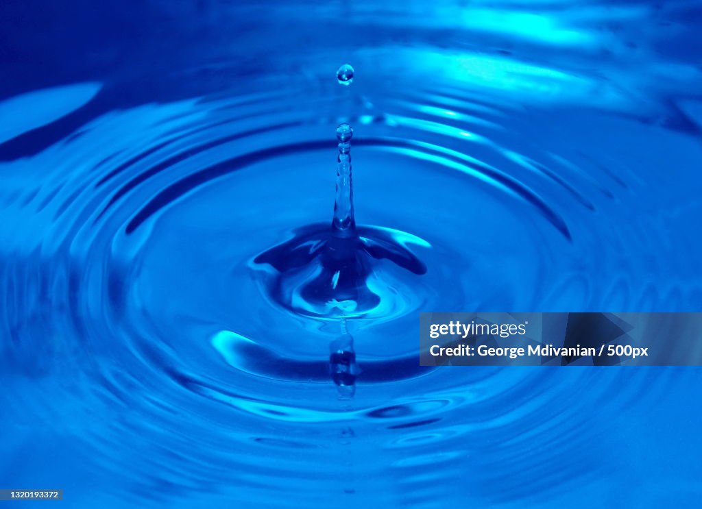 Falling Out Drop Closeup Of Drop Falling In Water High-Res Stock Photo - Getty Images