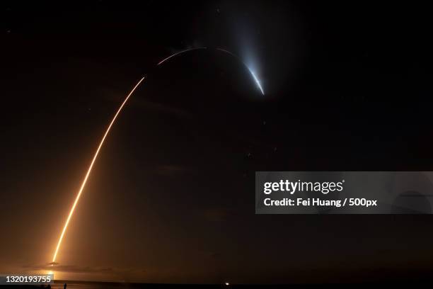 scenic view of sea against sky at night,cape canaveral,florida,united states,usa - launch stock pictures, royalty-free photos & images