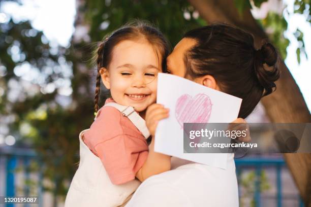 father and his child playing together - giving a girl head stock pictures, royalty-free photos & images