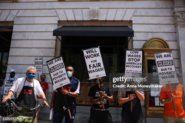 Activists with One Fair Wage participate in a “Wage Strike" demonstration outside of the Old Ebbitt Grill restaurant on May 26th, 2021 in Washington,...