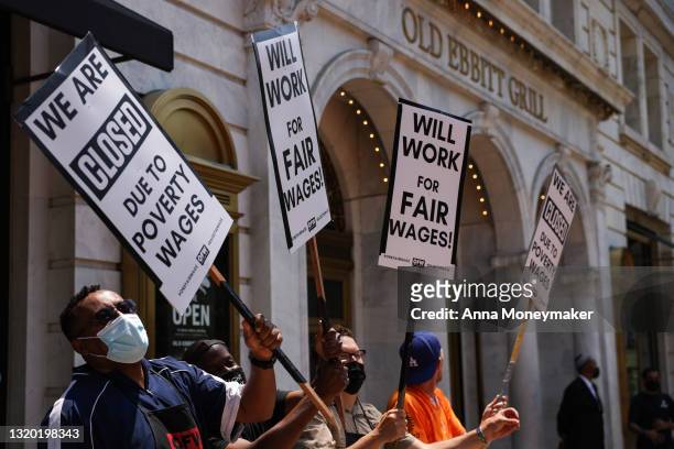 Activists with One Fair Wage participate in a “Wage Strike" demonstration outside of the Old Ebbitt Grill restaurant on May 26th, 2021 in Washington,...