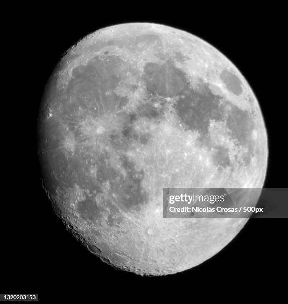 low angle view of moon against clear sky at night - 凸月 ストックフォトと画像