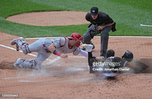 Adam Eaton of the Chicago White Sox is tagged out at the plate by Andrew Knizner of the St. Louis Cardinals in the 1st inning at Guaranteed Rate...