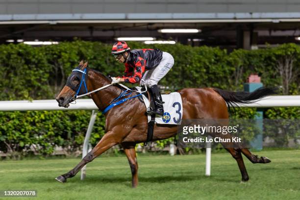 Jockey Joao Moreira riding Dancing Fighter wins the Race 7 Java Handicap at Happy Valley Racecourse on May 26, 2021 in Hong Kong. Dancing Fighter...