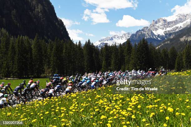 The peloton passing through mountain landscape during the 104th Giro d'Italia 2021, Stage 17 a 193km stage from Canazei to Sega di Ala 1246m / The...