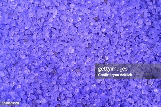 lavender bath salt with natural lavender essential oil, close up. - bath salt stock pictures, royalty-free photos & images