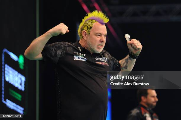 Peter Wright of Scotland celebrates after winning his match against Jonny Clayton of Wales during Night 15 of the Unibet Premier League Darts at...