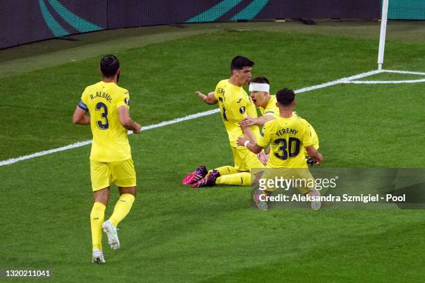 Gerard Moreno of Villarreal CF celebrates after scoring their sides first goal with team mates Juan Foyth and Yeremi Pino during the UEFA Europa...