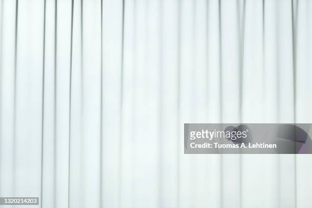 light coming through a sheer, transparent and pleated white curtains or drapes. - partiell lichtdurchlässig stock-fotos und bilder
