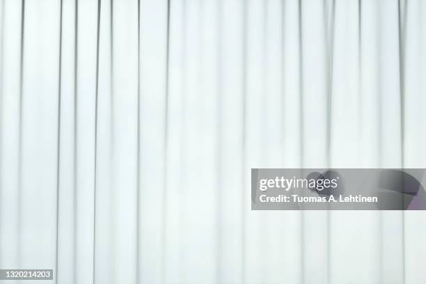 light coming through a sheer, transparent and pleated white curtains or drapes. - window treatment stock pictures, royalty-free photos & images