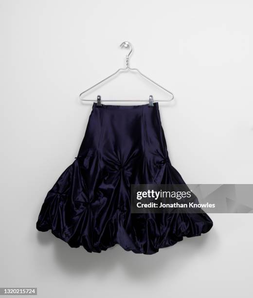black skirt on hanger - black skirt stockfoto's en -beelden