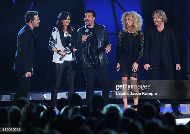 Lionel Richie performs with Little Big Town onstage at the 45th annual CMA Awards at the Bridgestone Arena on November 9, 2011 in Nashville,...