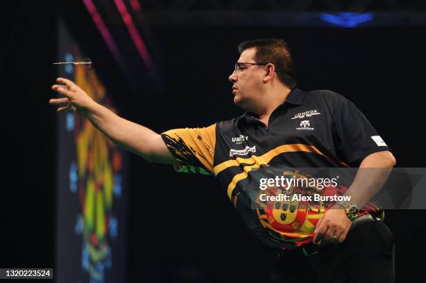 Jose de Sousa of Portugal in action in his match against Michael van Gerwen of The Netherlands during Night 15 of the Unibet Premier League Darts at...