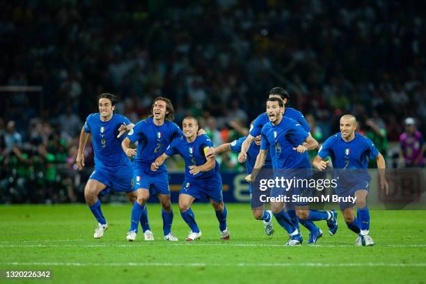 Luca Toni, Andrea Pirlo, Fabio Cannavaro, Daniele De Rossi, Vincenzo Iaquinta, Gianluca Zambrotta and Alessandro Del Piero of Italy celebrate as the...