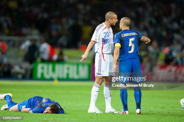 Fabio Cannavaro of Italy talking with David Trezeguet of France after the incident involving Zinedine Zidane of France and Marco Materazzi of Italy...