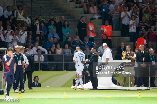 Zinedine Zidane of France walks of the pitch after receiving a red card for the headbutt on Marco Materazzie of Italy during the World Cup Final...