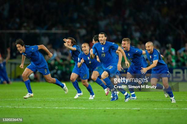 Luca Toni, Andrea Pirlo, Fabio Cannavaro, Daniele De Rossi, Vincenzo Iaquinta, Gianluca Zambrotta and Alessandro Del Piero of Italy celebrate as the...