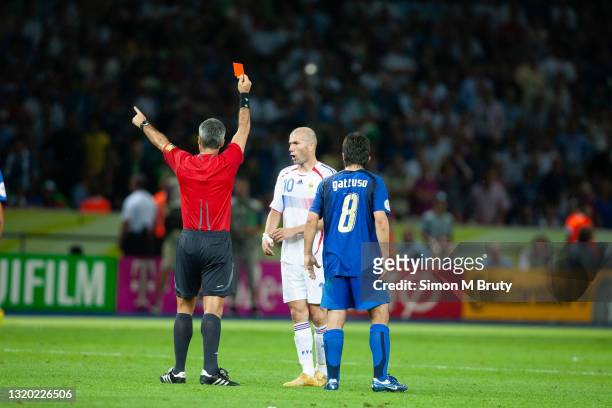 Horacio Elizondo of Argentina the referee issues the red card to Zinedine Zidane of France after the headbutt on Marco Materazzie of Italy , Gennaro...