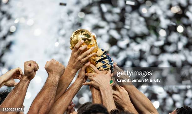 The Italian team with there hands on the World Cup Trophy. World Cup Final match between France and Italy . Italy would win on penalties to at the...