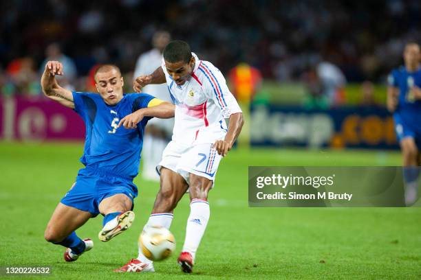 Florent Malouda of France and Fabio Cannarvaro of Italy in action during the World Cup Final match between France and Italy . Italy would win on...