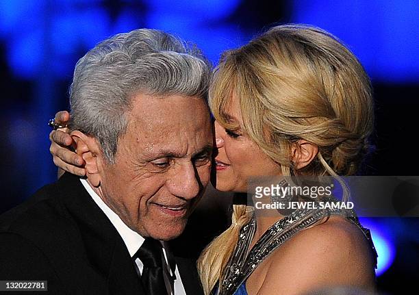 Colombian musician Shakira embraces her father William Mebarak during the 2011 Latin Recording Academy's Person of the Year event on the sideline of...