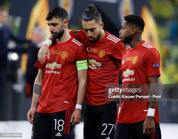 Bruno Fernandes, Alex Telles and Fred of Manchester United look dejected following the UEFA Europa League Final between Villarreal CF and Manchester...