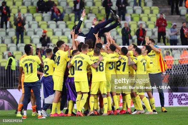 Unai Emery, Head Coach of Villarreal CF is thrown in the air by the players after the UEFA Europa League Final between Villarreal CF and Manchester...