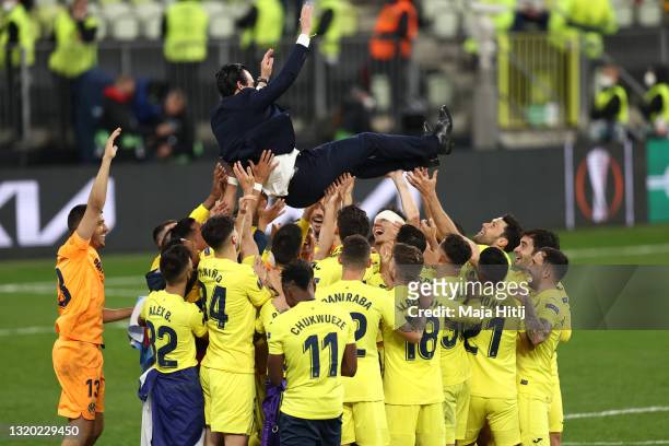 Unai Emery, Head Coach of Villarreal CF is thrown into the air as their side celebrate winning the UEFA Europa League Final between Villarreal CF and...