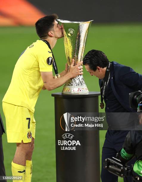 Gerard Moreno of Villarreal CF kisses the UEFA Europa League Trophy following victory in the UEFA Europa League Final between Villarreal CF and...