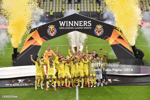 Mario and Raul Albiol of Villarreal CF lift the UEFA Europa League Trophy as their team mates celebrate following victory in the UEFA Europa League...