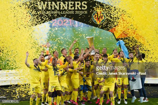 Mario and Raul Albiol of Villarreal lift the UEFA Europa League Trophy following victory in the UEFA Europa League Final between Villarreal CF and...