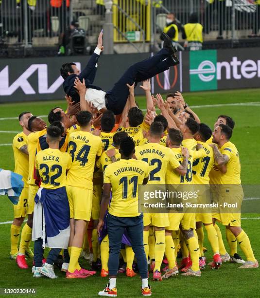 Unai Emery, Head Coach of Villarreal CF is thrown in the air by the players after the UEFA Europa League Final between Villarreal CF and Manchester...