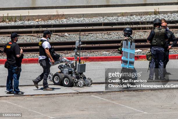 Santa Clara County Sheriff"u2019s Department deploy a robot at the parking lot of the VTA Light Rail Facility, Wednesday, May 26 in San Jose, Calif....