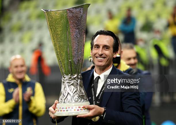 Unai Emery, Head Coach of Villarreal CF celebrates with the UEFA Europa League Trophy following victory in the UEFA Europa League Final between...
