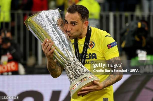 Paco Alcacer of Villarreal CF kisses the UEFA Europa League Trophy following victory in the UEFA Europa League Final between Villarreal CF and...
