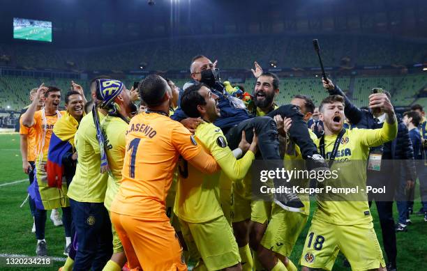 Former Villarreal CF Footballer Santi Cazorla is thrown into the air in celebration following the UEFA Europa League Final between Villarreal CF and...