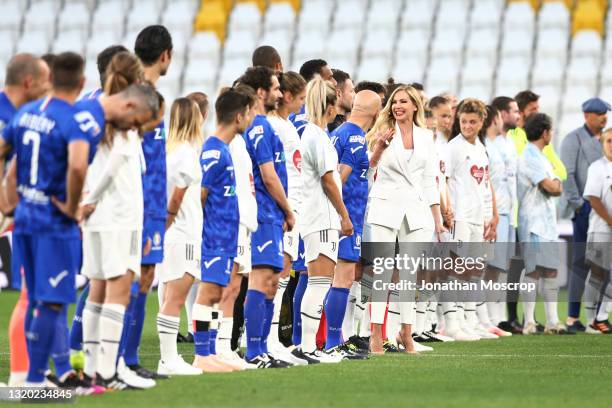 Mediaset's Italian Presenter Federica Panicucci speaks with Italian Singer-Songwriter Enrico Ruggeri as the teams and officials line up prior to kick...