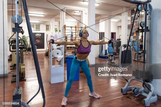 Woman trains inside a gym on May 26, 2021 in Salerno, Italy. The Reopening Decree signed by the Mario Draghi government triggered the opening of the...