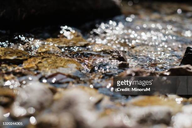 shining stream - 水 流れ ストックフォトと画像