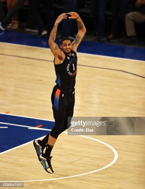 Obi Toppin of the New York Knicks celebrates his dunk in the fourth quarter against the Atlanta Hawks during game two of the Eastern Conference...