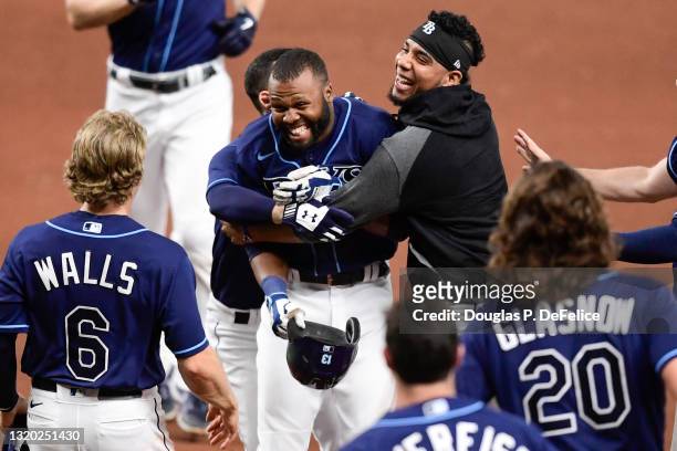 Manuel Margot of the Tampa Bay Rays reacts with his teammates after hitting an RBI single during the tenth inning to defeat the Kansas City Royals...