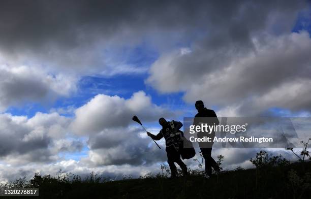 Ashley Chesters of England walks off the 12th tee with caddie during the first round of the Made in HimmerLand presented by FREJA at Himmerland Golf...