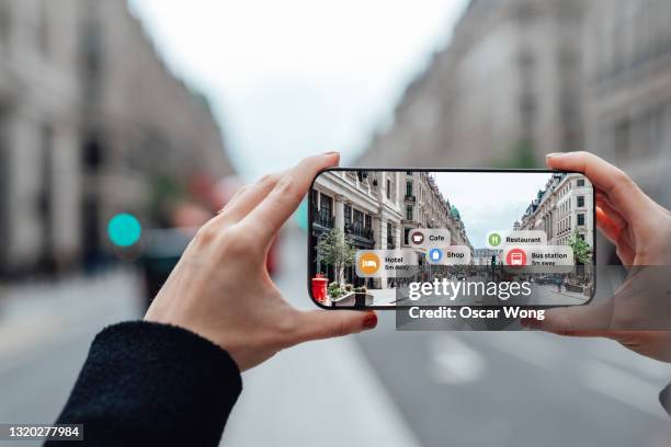 finding direction with augmented reality on smartphone on street - augmented reality bildbanksfoton och bilder