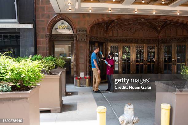 Person gets a COVID-19 test outside The Late Show with Stephen Colbert at the Ed Sullivan Theater on May 26, 2021 in New York City. "The Late Show...