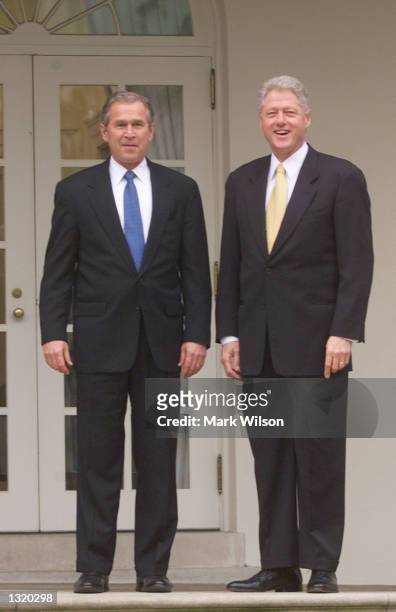 President Bill Clinton, right, stands with President-elect George W. Bush before their meeting December 19, 2000 at the White House in Washington, DC.