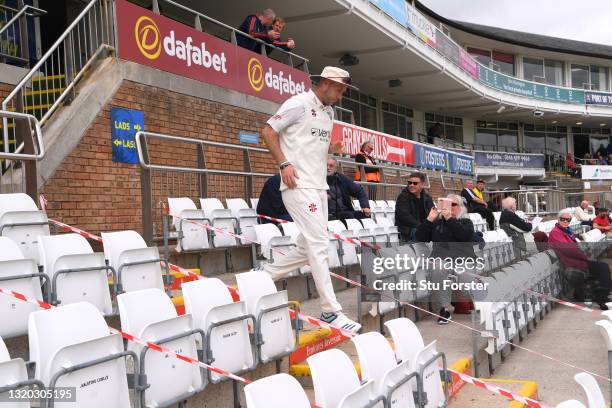 Durham bowler Chris Rushworth makes his way down the pavilion steps to the pitch past spectators for the first time at the Riverside this season...