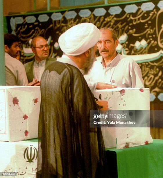 An Iranian cleric casts his vote in the presidential election at the Hosseinieh Jamaran mosque June 8, 2001 in northern Tehran, Iran. President...