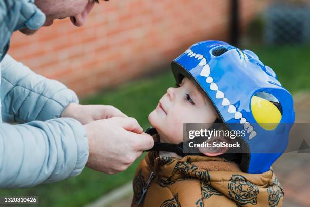 fasten it tightly - cycling helmet stock pictures, royalty-free photos & images