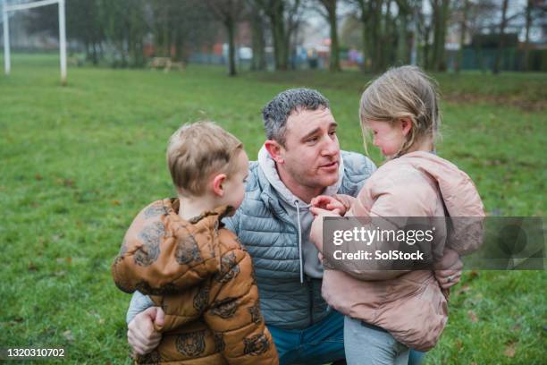 dont cry sweetheart - family with two children british stock pictures, royalty-free photos & images