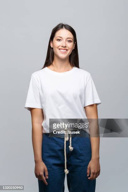 portrait of happy female student - woman white t shirt stock pictures, royalty-free photos & images